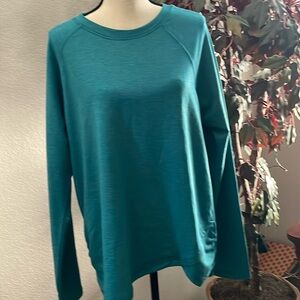 Danskin Teal Xl workout shirt. Long sleeved with ruching on lower sides